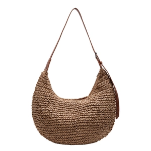 Brown woven hobo tote bag with adjustable leather strap and spacious interior
