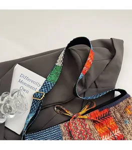 Close-up of adjustable colorful canvas strap and metal buckle on patchwork tote bag