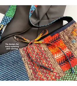 Detail of bohemian tote bag featuring drawstring closure and vibrant geometric patterns