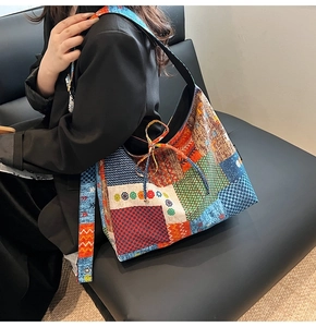 Detail of bohemian tote bag with patchwork patterns and decorative drawstring tie