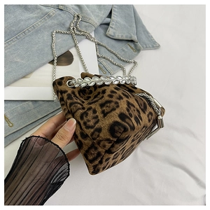 Detail of leopard print bucket bag featuring crystal trim and silver chain strap