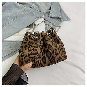 Close-up of leopard print bucket bag with silver chain strap and soft velvet texture