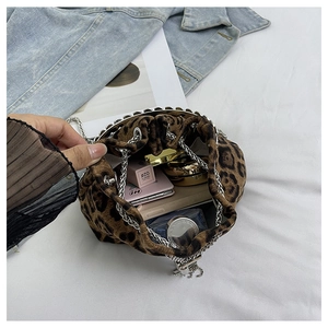 Interior view of leopard print bucket bag showing space for cosmetics and essentials