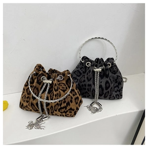 Detail of leopard print bucket bags with silver ring handles and chain drawstrings