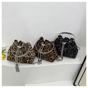 Close-up of leopard print bucket bags in light brown, dark brown and grey-black colors