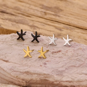 Minimalist stainless steel starfish stud earrings set in black, silver, and gold finishes