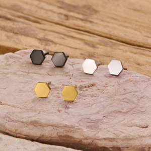 Set of three geometric hexagonal stainless steel studs in black, silver, and gold finish