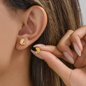 Minimalist gold dolphin stud earrings made of polished stainless steel for daily wear