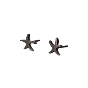 Minimalist matte black starfish stud earrings in stainless steel on a white background