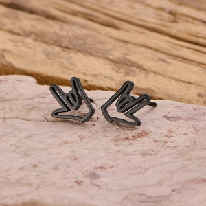 Macro detail of matte black stainless steel earrings featuring I Love You hand gesture