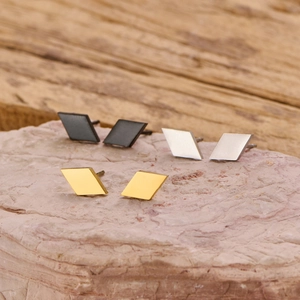 Minimalist geometric diamond stud earrings set in silver, gold, and black stainless steel