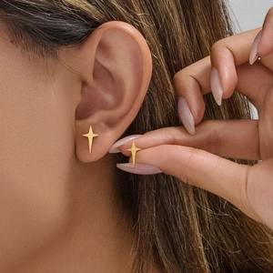 Minimalist gold star earrings for women with elegant North Star design on ears