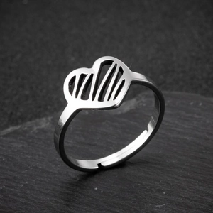 Minimalist stainless steel open ring with heart-shaped design on dark rock background
