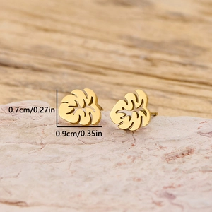 Golden monstera leaf stud earrings in stainless steel measuring 0.7cm by 0.9cm