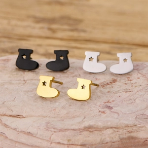 Minimalist Christmas boot stud earrings in black, silver, and gold with cutout stars