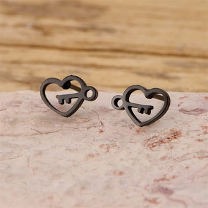 Detailed view of matte black heart-shaped stud earrings with a unique hollow key design