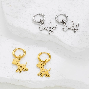 Polished stainless steel giraffe hoop earrings in silver and gold finishes on stone