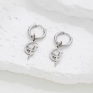 Silver stainless steel hoop earrings featuring hollow moon and fairy wand pendants