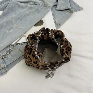 Leopard print bucket bag with silver chain strap and herringbone fabric lining