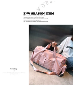 Pink waterproof fitness bag with shoe compartment and adjustable shoulder strap detail