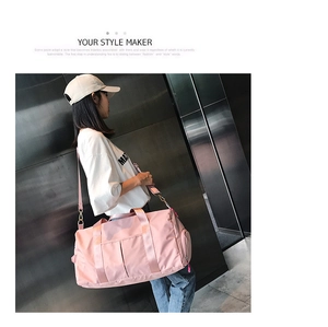 Detailed view of pink yoga fitness bag with waterproof nylon and detachable shoulder strap