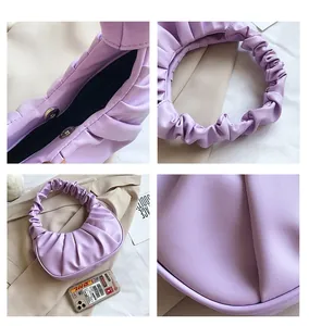 Macro detail of purple pleated Hobo bag with silver magnetic closure and ruffles