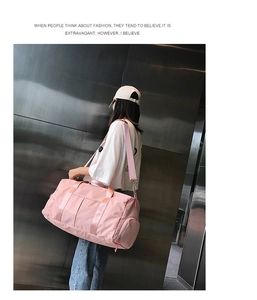 Pink travel bag detail featuring a specialized separate compartment for wet clothes or shoes