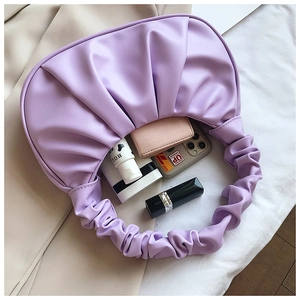 Internal view of purple cloud pleated PU bag showing capacity for phone and cosmetics
