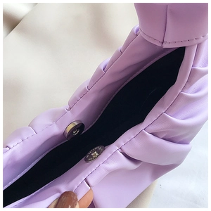 Detailed shot of lavender cloud bag with magnetic closure and soft pleated leather