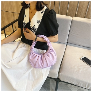 Detail of light purple pleated cloud bag showing soft PU texture and elegant ruching handle