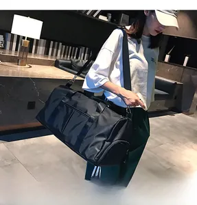 Detail view of large gym bag featuring separate shoe compartment and nylon fabric