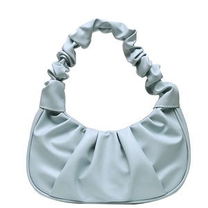 Detail of light blue cloud pleated handbag with soft ruching and thick PU strap