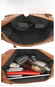 Internal display of large brown leather tote showing fabric lining and multiple pockets
