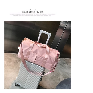 Pink large travel bag on silver suitcase featuring a dry-wet separation shoe compartment