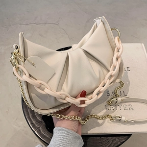 Chic cream white ruched dumpling bag with acrylic chain and metallic shoulder strap