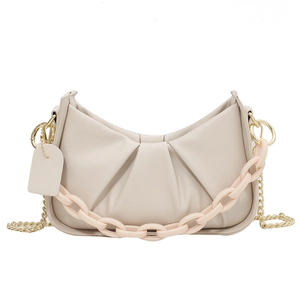 Chic beige pleated cloud shoulder bag with macaron chain and gold strap on white background