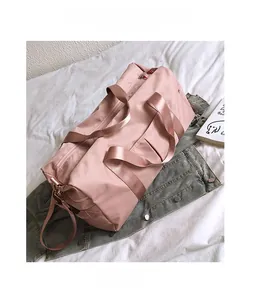 Pink waterproof fitness travel bag with shoe compartment and reinforced handles