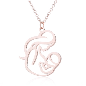 Rose gold mother and child silhouette necklace on a clean white background with reflection