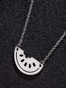 Close-up of a silver-tone stainless steel necklace with a bitten watermelon slice pendant