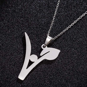 Arabic calligraphy stainless steel pendant necklace on black textured background
