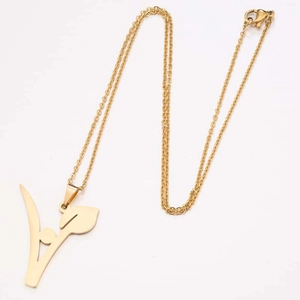 Detail view of gold letter A pendant with leaf design on a fine metal chain necklace