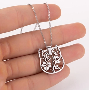 Silver stainless steel necklace featuring a hollow cat head pendant with floral pattern