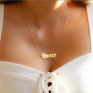 Gothic style gold Honey pendant necklace on model showcasing elegant collarbone chain