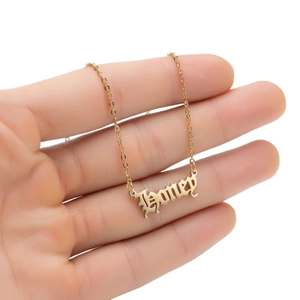 Gold stainless steel necklace featuring a Gothic Honey pendant with polished finish