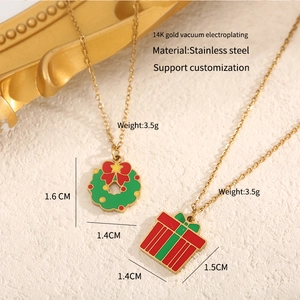 Detail of Christmas wreath and gift box pendant necklace in 14K gold plated stainless steel