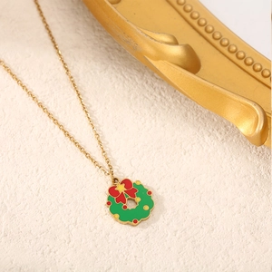 Gold Christmas wreath necklace with green oil drop pendant and red bow tie charm