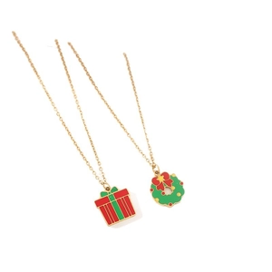 Golden Christmas wreath and red gift box necklaces set on a minimal white background
