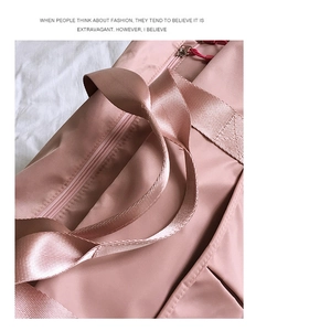Detail of high-density pink nylon fabric with premium stitching and metal zipper
