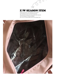Detail view of pink sports bag featuring internal waterproof wet and dry separation pocket