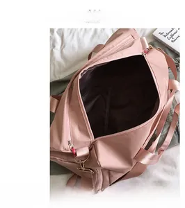 Pink fitness travel bag with separate shoe compartment and adjustable shoulder straps